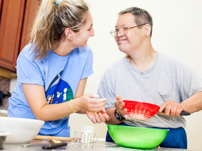 Down syndrome man cooking